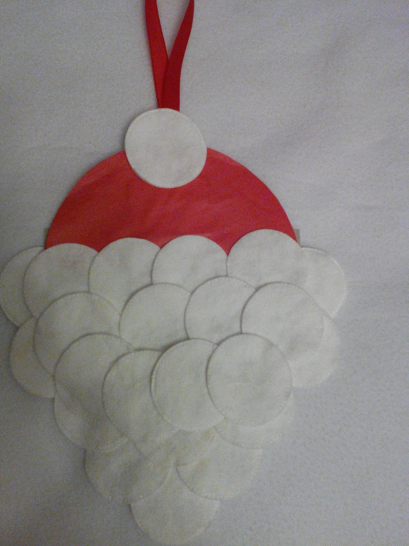 Babbo Natale da dischetti di cotone artigianale con un bambino